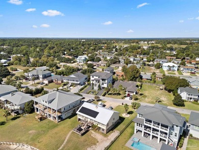 Experience modern coastal elegance in this architecturally on Tiger Point Golf and Country Club in Florida - for sale on GolfHomes.com, golf home, golf lot