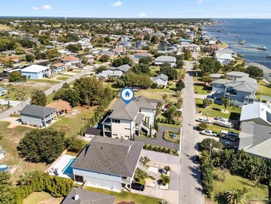 Experience modern coastal elegance in this architecturally on Tiger Point Golf and Country Club in Florida - for sale on GolfHomes.com, golf home, golf lot
