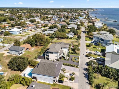 Experience modern coastal elegance in this architecturally on Tiger Point Golf and Country Club in Florida - for sale on GolfHomes.com, golf home, golf lot
