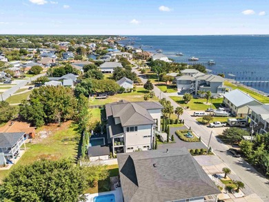 Experience modern coastal elegance in this architecturally on Tiger Point Golf and Country Club in Florida - for sale on GolfHomes.com, golf home, golf lot