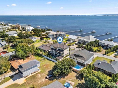 Experience modern coastal elegance in this architecturally on Tiger Point Golf and Country Club in Florida - for sale on GolfHomes.com, golf home, golf lot