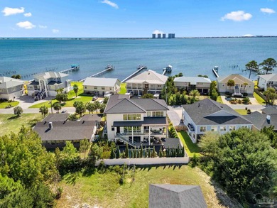 Experience modern coastal elegance in this architecturally on Tiger Point Golf and Country Club in Florida - for sale on GolfHomes.com, golf home, golf lot