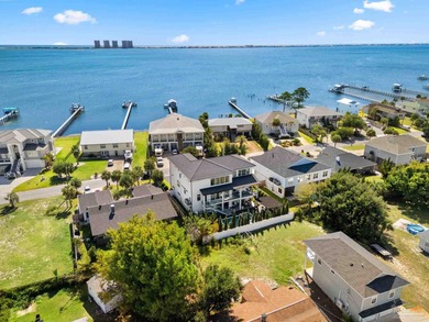 Experience modern coastal elegance in this architecturally on Tiger Point Golf and Country Club in Florida - for sale on GolfHomes.com, golf home, golf lot