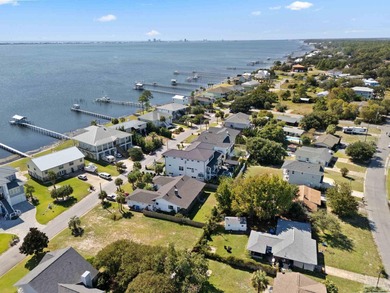 Experience modern coastal elegance in this architecturally on Tiger Point Golf and Country Club in Florida - for sale on GolfHomes.com, golf home, golf lot