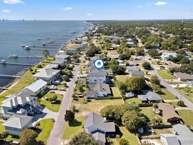 Experience modern coastal elegance in this architecturally on Tiger Point Golf and Country Club in Florida - for sale on GolfHomes.com, golf home, golf lot