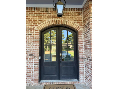 This inviting home sits on the Whisper Lake Golf Course in the on Annandale Golf Club in Mississippi - for sale on GolfHomes.com, golf home, golf lot
