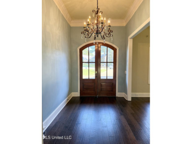 This inviting home sits on the Whisper Lake Golf Course in the on Annandale Golf Club in Mississippi - for sale on GolfHomes.com, golf home, golf lot