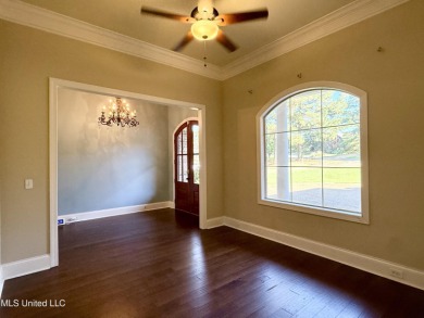 This inviting home sits on the Whisper Lake Golf Course in the on Annandale Golf Club in Mississippi - for sale on GolfHomes.com, golf home, golf lot