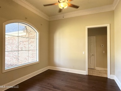 This inviting home sits on the Whisper Lake Golf Course in the on Annandale Golf Club in Mississippi - for sale on GolfHomes.com, golf home, golf lot