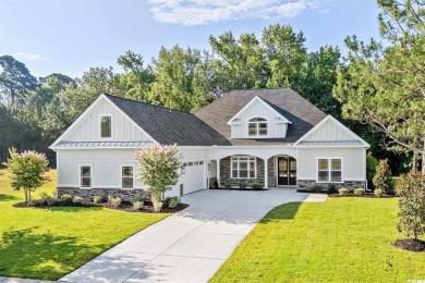 This brand-new custom home boasts 5 spacious bedrooms and 4 on Wild Wing Plantation in South Carolina - for sale on GolfHomes.com, golf home, golf lot