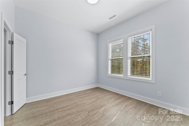 This recently built modern farmhouse (2024) still looks brand on Granada Farms Country Club in North Carolina - for sale on GolfHomes.com, golf home, golf lot