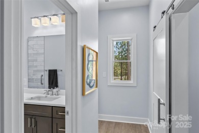 This recently built modern farmhouse (2024) still looks brand on Granada Farms Country Club in North Carolina - for sale on GolfHomes.com, golf home, golf lot