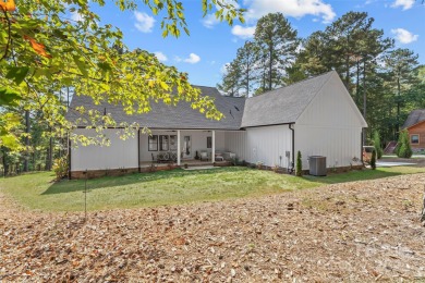 This recently built modern farmhouse (2024) still looks brand on Granada Farms Country Club in North Carolina - for sale on GolfHomes.com, golf home, golf lot