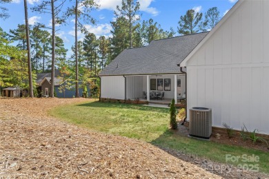This recently built modern farmhouse (2024) still looks brand on Granada Farms Country Club in North Carolina - for sale on GolfHomes.com, golf home, golf lot