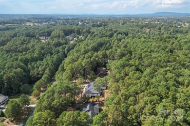 This recently built modern farmhouse (2024) still looks brand on Granada Farms Country Club in North Carolina - for sale on GolfHomes.com, golf home, golf lot