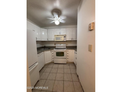 Beautiful, light-filled upper-floor 2-bedroom, 2 full bath unit on Pine Brook Golf Course in New Jersey - for sale on GolfHomes.com, golf home, golf lot