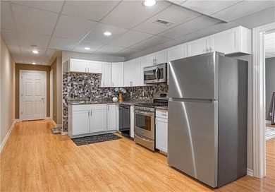 This beautifully maintained 4-bedroom, 3-bath home is located in on Harrison Country Club in Arkansas - for sale on GolfHomes.com, golf home, golf lot