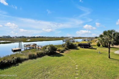 Welcome to waterfront living on Big Davis Canal! Looking out on Founders Club At St. James Plantation in North Carolina - for sale on GolfHomes.com, golf home, golf lot