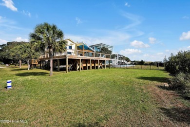 Welcome to waterfront living on Big Davis Canal! Looking out on Founders Club At St. James Plantation in North Carolina - for sale on GolfHomes.com, golf home, golf lot