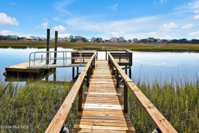 Welcome to waterfront living on Big Davis Canal! Looking out on Founders Club At St. James Plantation in North Carolina - for sale on GolfHomes.com, golf home, golf lot