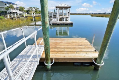 Welcome to waterfront living on Big Davis Canal! Looking out on Founders Club At St. James Plantation in North Carolina - for sale on GolfHomes.com, golf home, golf lot