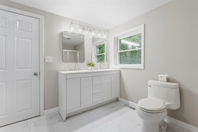 Nestled on a quiet dead-end street, this beautifully updated on Bolduc Park Golf Course in New Hampshire - for sale on GolfHomes.com, golf home, golf lot