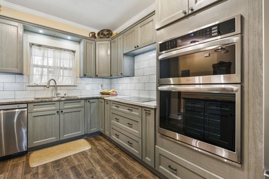 Step into easy, first floor living with fairway views that feel on Myrtlewood Golf Course and Club  in South Carolina - for sale on GolfHomes.com, golf home, golf lot