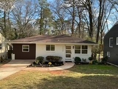 Welcome home! This beautifully remodeled 3-bedroom, 2 bath home on East Lake Golf Club in Georgia - for sale on GolfHomes.com, golf home, golf lot