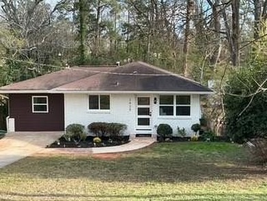 Welcome home! This beautifully remodeled 3-bedroom, 2 bath home on East Lake Golf Club in Georgia - for sale on GolfHomes.com, golf home, golf lot