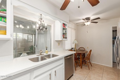 Enjoy comfortable and low-maintenance living in this delightful on Sun City Lakes West and East in Arizona - for sale on GolfHomes.com, golf home, golf lot