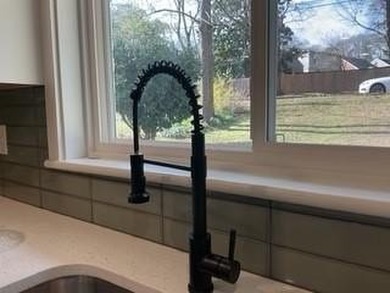 Welcome home! This beautifully remodeled 3-bedroom, 2 bath home on East Lake Golf Club in Georgia - for sale on GolfHomes.com, golf home, golf lot