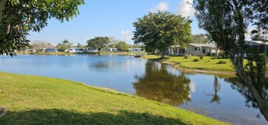 This fully furnished 1995 2-bed, 2-bath waterfront home in the on The Club At Pointe West in Florida - for sale on GolfHomes.com, golf home, golf lot
