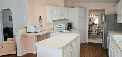 This fully furnished 1995 2-bed, 2-bath waterfront home in the on The Club At Pointe West in Florida - for sale on GolfHomes.com, golf home, golf lot