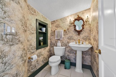 Experience timeless elegance in this meticulously maintained on Bayou Golf Club in Florida - for sale on GolfHomes.com, golf home, golf lot