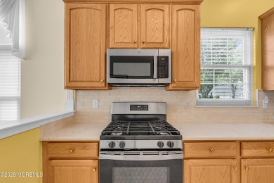 This Extended Elm with 4 Season Sunroom Sits On a Large Corner on Four Seasons Spa and Country Club in New Jersey - for sale on GolfHomes.com, golf home, golf lot
