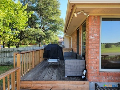 Enjoy a large main living room with a wood-burning fireplace on Hills of Cove Municipal Golf Course in Texas - for sale on GolfHomes.com, golf home, golf lot