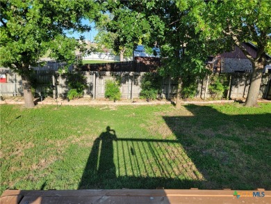 Enjoy a large main living room with a wood-burning fireplace on Hills of Cove Municipal Golf Course in Texas - for sale on GolfHomes.com, golf home, golf lot