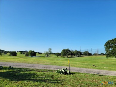 Enjoy a large main living room with a wood-burning fireplace on Hills of Cove Municipal Golf Course in Texas - for sale on GolfHomes.com, golf home, golf lot