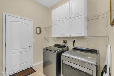 This Extended Elm with 4 Season Sunroom Sits On a Large Corner on Four Seasons Spa and Country Club in New Jersey - for sale on GolfHomes.com, golf home, golf lot
