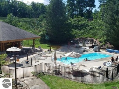 Bellaire, Michigan:  Side-by-side parcels form a private retreat on Cedar River Golf Course in Michigan - for sale on GolfHomes.com, golf home, golf lot