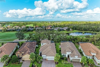 Welcome to 13902 Messina Loop in Esplanade. Relax in the pool on Esplanade Golf and Country at Lakewood Ranch in Florida - for sale on GolfHomes.com, golf home, golf lot