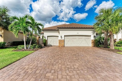 Welcome to 13902 Messina Loop in Esplanade. Relax in the pool on Esplanade Golf and Country at Lakewood Ranch in Florida - for sale on GolfHomes.com, golf home, golf lot