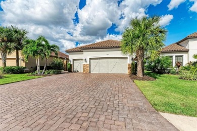 Welcome to 13902 Messina Loop in Esplanade. Relax in the pool on Esplanade Golf and Country at Lakewood Ranch in Florida - for sale on GolfHomes.com, golf home, golf lot