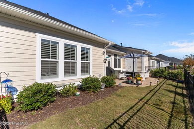 Enjoy maintenance-free coastal living in the premier gated on Members Club At St. James Plantation in North Carolina - for sale on GolfHomes.com, golf home, golf lot