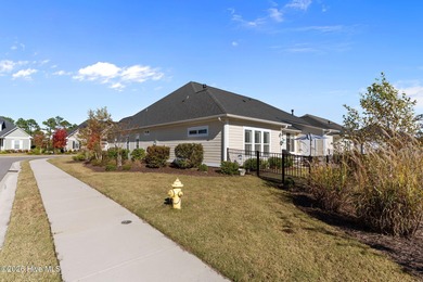 Enjoy maintenance-free coastal living in the premier gated on Members Club At St. James Plantation in North Carolina - for sale on GolfHomes.com, golf home, golf lot