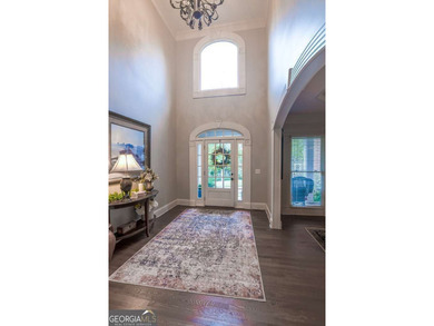 Experience refined living at 1041 Windermere Crossing an elegant on Windermere Golf Club in Georgia - for sale on GolfHomes.com, golf home, golf lot