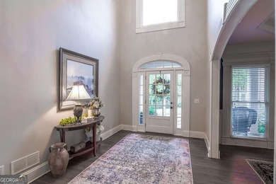 Experience refined living at 1041 Windermere Crossing an elegant on Windermere Golf Club in Georgia - for sale on GolfHomes.com, golf home, golf lot