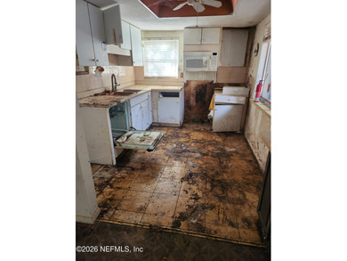 A RARE OPPORTUNITY FOR A GOLF COURSE FIXER! Come see this 3 bed on Palm Harbor Golf Club in Florida - for sale on GolfHomes.com, golf home, golf lot