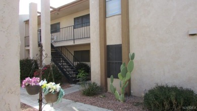 Easy access downstairs condo with patio view of pool and spa on Chaparral Golf and Country Club in Arizona - for sale on GolfHomes.com, golf home, golf lot