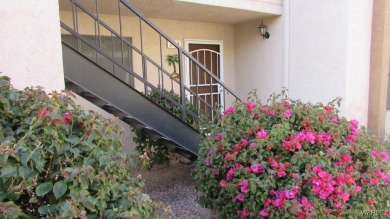 Easy access downstairs condo with patio view of pool and spa on Chaparral Golf and Country Club in Arizona - for sale on GolfHomes.com, golf home, golf lot